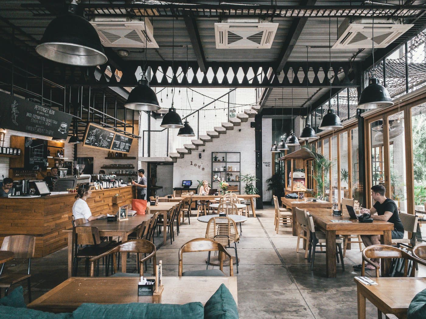 Restaurant counter with stools and warm lighting