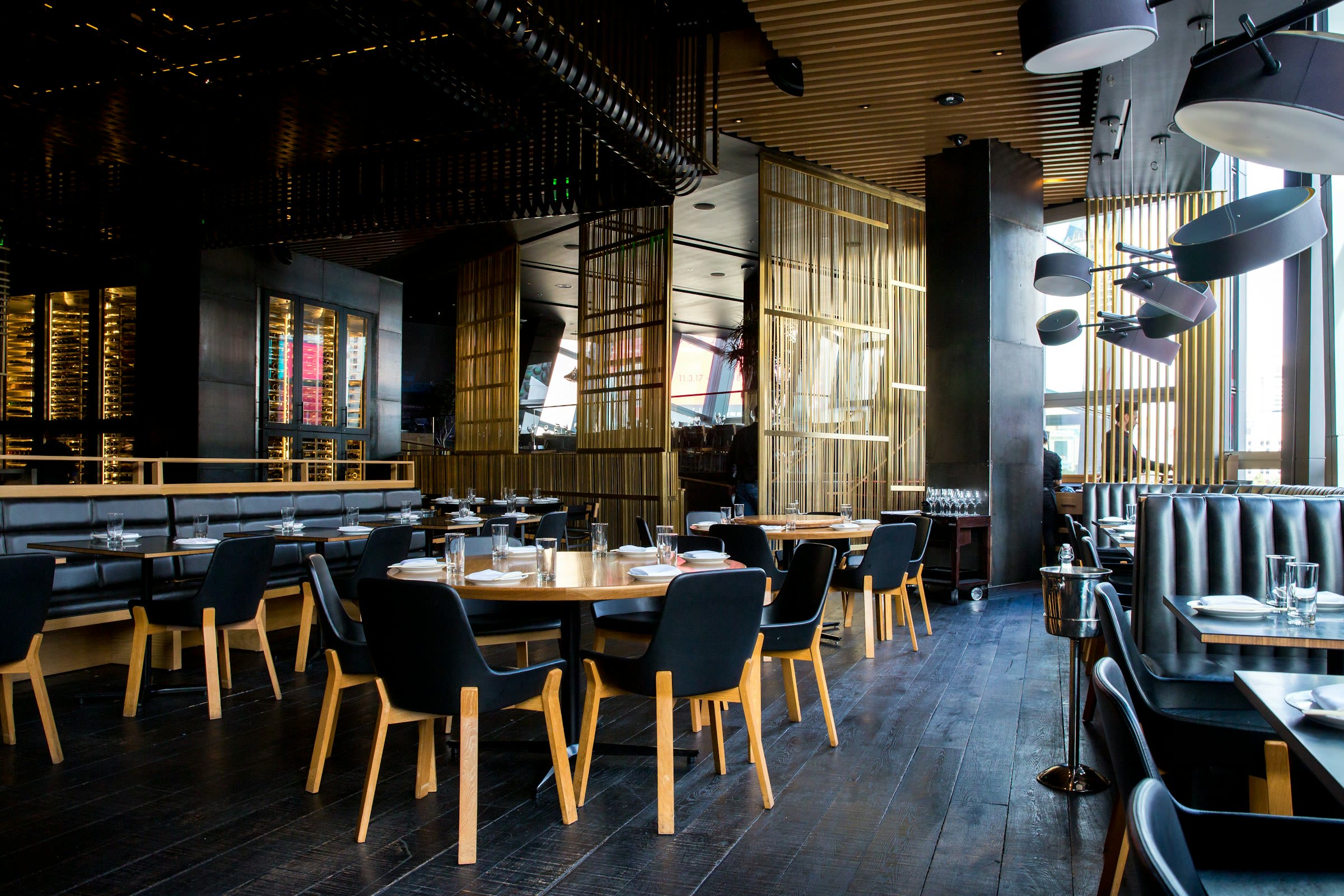 Warm dining room with tables set for service